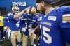 Winnipeg Blue Bombers' Myles White (14) is congratulated for his 80 yard touchdown by, from left, quarterbacks Zack Mahoney (4) and Matt Nichols (15) during the second half of pre-season CFL action in Winnipeg Friday, June 1, 2018. THE CANADIAN PRESS/John Woods