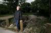 PHIL HOSSACK / WINNIPEG FREE PRESS
Ken Klassen poses in a vacant lot near his home, it's also in the way of the St. James Bridge expansion. While a similar lot across the lane from this is well kept by the city, this one is seldom mowed and trash piles up.