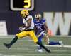 Derel Walker struts past Kevin Fogg Thursday night. Edmonton QB Mike Reilly hooked up with Walker for a 101-yard TD strike before the game was four minutes old. (Phil Hossack / Winnipeg Free Press)