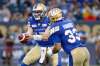 THE CANADIAN PRESS/John Woods
Winnipeg Blue Bombers quarterback Chris Streveler, left, hands off to Andrew Harris against the Edmonton Eskimos during the first half of CFL action in Winnipeg Thursday, June 14, 2018.