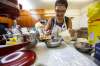 MIKE DEAL / WINNIPEG FREE PRESS
Hilda Terry mixes the honey biscuit dough.