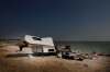 A trailer that was pulled from the water sits on the shore of Margaret Bruce Beach.