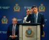 PHIL HOSSACK / WINNIPEG FREE PRESS FILES
Police Chief Danny Smyth (centre) and Mayor Brian Bowman, with police board chairman David Asper (seated), at a July media briefing to unveil the 2017 crime stats report.