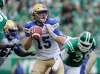 MARK TAYLOR / THE CANADIAN PRESS
Winnipeg Blue Bombers quarterback Matt Nichols looks for a receiver as Saskatchewan Roughriders' Charleston Hughes closes in during first half CFL football action at Mosaic Stadium in Regina on Sunday, Sept. 2, 2018.