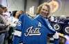 Heather Alcock, from Kenora, Checks out the new Jets jersey this morning. (Trevor Hagan photos / Winnipeg Free Press)