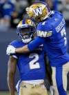 JOHN WOODS / THE CANADIAN PRESS FILES
Kenbrell Thompkins (left) and Weston Dressler celebrate one of Thompkins&rsquo; five catches in Friday&rsquo;s win.