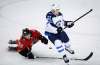 THE CANADIAN PRESS/Jeff McIntosh
Winnipeg Jets' Nikolaj Ehlers, right, slams Calgary Flames' Andrew Mangiapane to the ice during preseason NHL hockey action in Calgary, Monday.