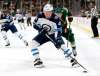 AP Photo/Andy Clayton-King
Winnipeg Jets left wing Brendan Lemieux controls the puck in front of Minnesota Wild right wing Charlie Coyle during the first period of a preseason NHL hockey game Wednesday in St. Paul, Minn.
