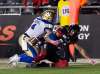Photos by Adrian Wyld / The Canadian Press Files
Winnipeg Blue Bombers linebacker Adam Bighill (left) knocks the ball loose from Ottawa Redblacks wide receiver Brad Sinopoli during overtime in Ottawa on Friday.