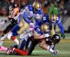 Adrian Wyld / THE CANADIAN PRESS FILES
Winnipeg Blue Bombers defensive backs Taylor Loffler, Adam Bighill and Anthony Gaitor bring down Ottawa Redblacks wide receiver Diontae Spencer last Friday in Ottawa. The Bombers defence surrendered 437 net yards in the 40-32 overtime win.