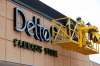 THE CANADIAN PRESS/John Woods
Sign installers work on the finishing touches to the new Delta 9 Cannabis Store signage in Winnipeg.