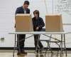 black jacket), 10, and Austin (grey jacket
MIKE DEAL / WINNIPEG FREE PRESSBrian and Tracy Bowman bring their kids Hayden , 8, to the voting booth at École Charleswood School Wednesday morning to vote in the civic election.181024 - Wednesday, October 24, 2018.