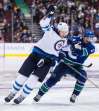 Darryl Dyck / The Canadian Press files
Jets forward Blake Wheeler (left, alongside Canucks&rsquo; Derrick Pouliot) will be celebrating U.S. Thanksgiving in Minnesota with his family.