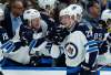 Jeff Roberson / The Associated Press Files
Patrik Laine is congratulated by teammate Brendan Lemieux (left) after scoring his second of five goals during the Jets game against the St. Louis Blues on Saturday.