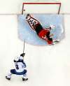 Julio Cortez / The Associated Press
Winnipeg Jets center Andrew Copp, bottom, scores a goal against New Jersey Devils goaltender Keith Kinkaid, top, during the third period of an NHL hockey game, Saturday, Dec. 1, 2018, in Newark, N.J. The Jets won 4-3 in overtime.