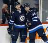 JOHN WOODS / WINNIPEG FREE PRESS FILES
Winnipeg Jets defence partners Jacob Trouba, left, and Josh Morrissey are both on pace to surpass career highs in goals, assists, points and ice time per game this season.