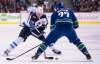 Jonathan Hayward / THE CANADIAN PRESS
Winnipeg Jets right wing Patrik Laine (29) tries to get the puck past Vancouver Canucks defenceman Ben Hutton (27) during first-period NHL action at Rogers Arena in Vancouver last month.