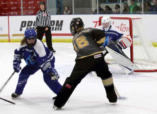 SUPPLIED
In Manitoba’s 8-7 double OT victory over Alberta at the Canada Games they came back from a 6-1 deficit while Alana Lesperance, centre, had four goals in the game.