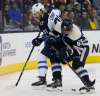 Jay LaPrete / The Associated Press
Jets winger Kyle Connor (left) and Columbus Blue Jackets defender Markus Nutivaara fight for the puck Sunday night in Columbus, Ohio.