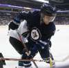 JOHN WOODS / WINNIPEG FREE PRESS FILES
Winnipeg Jets' Nikolaj Ehlers battles in the corner during a game against the San Jose Sharks in Winnipeg.