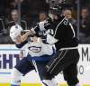 Los Angeles Kings' Kyle Clifford, right, fights with Winnipeg Jets' Nathan Beaulieu during the third period of an NHL hockey game Monday, March 18, 2019, in Los Angeles. (AP Photo/Marcio Jose Sanchez)