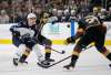 Winnipeg Jets left wing Brandon Tanev, left, tries to skate around Vegas Golden Knights right wing Mark Stone, center, and defenseman Shea Theodore during the first period of an NHL hockey game Thursday, March 21, 2019, in Las Vegas. (AP Photo/John Locher)