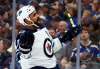 Jeff Roberson / The Associated Press
Winnipeg Jets' Dustin Byfuglien celebrates after scoring during the third period in Game 3 of an NHL first-round hockey playoff series against the St. Louis Blues Sunday in St. Louis. The Jets won 6-3.