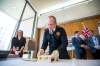 Fire Paramedic Service Chief John Lane opens a time capsule on Tuesday from 1965. (Mikaela MacKenzie / Winnipeg Free Press)