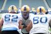 RUTH BONNEVILLE / WINNIPEG FREE PRESS
Offensive lineman Michael Couture (centre) throws his weight around during Bombers training camp on Friday at IG Field. He&rsquo;s hoping to nail down the starter&rsquo;s role at centre.