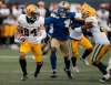 PHIL HOSSACK / WINNIPEG FREE PRESS
Edmonton Eskimos' Josh Stangby scampers away from Blue Bombers' Abu Conteh in Pre-Season action at IG Field Friday.