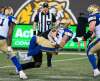 PETER POWER / THE CANADIAN PRESS
Winnipeg Blue Bombers quarterback Matt Nichols is sacked by Hamilton Tiger-Cats defensive end Adrian Tracy during CFL action in Hamilton on Friday.