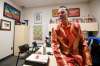 Chase, decked out in a polyester bacon suit at his Shaw Park office, brings the sizzle to Goldeyes&rsquo; promotions. (John Woods / Winnipeg Free Press)