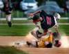 PHIL HOSSACK / WINNIPEG FREE PRESS
St Boniface baserunner Kyle Becker slams his head into the gravel at second base in a three-way collision with Elmwood&rsquo;s Owen Harms (top) and Zach Delaquis.