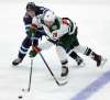 PHIL HOSSACK / WINNIPEG FREE PRESS
Winnipeg Jets' Andrew Copp works against Minnesota Wild Jordan Greenway Wednesday.