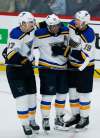 THE CANADIAN PRESS/John Woods
St. Louis Blues Klim Kostin (37), David Perron (57) and Jay Bouwmeester (19) celebrate Perron's game winning goal against the Winnipeg Jets in overtime NHL action in Winnipeg on Friday.