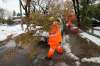 A city crew cleans up tree branches on Sunday after the snow storm in which 34 cm of snow fell. (John Woods / Winnipeg Free Press)