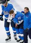 JOHN WOODS / WINNIPEG FREE PRESS
Jets forward Bryan Little is helped off the ice Tuesday after getting hit by a puck.