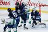 John Woods / The Canadian Press
Winnipeg Jets&rsquo; Luca Sbisa, centre, blocks a shot with his toe against the Vancouver Canucks&rsquo; while he battles for position with Elias Pettersson last Friday.