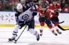 (AP Photo/Lynne Sladky)
Winnipeg Jets' Patrik Laine skates with the puck as Florida Panthers' Dryden Hunt pursues during the second period Thursday in Sunrise, Fla.