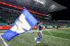 JEFF MCINTOSH / THE CANADIAN PRESS
Winnipeg Blue Bombers&rsquo; Andrew Harris carries a team flag after defeating the Saskatchewan Roughriders in the CFL West Division final in Regina, Sunday.
