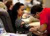 PHIL HOSSACK / WINNIPEG FREE PRESS
Shlar Ali watches as phlebotomist Dan Caballero prepares for her blood donation. Ali and other members of the Syrian Community took time to volunteer blood donations at the Canadian Blood Services Monday evning.