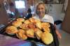 JOE.BRYKSA@FREEPRESS.MB.CA 
Elder Alice McDougall with fresh bannock she made in a home with no running water. Alice and her spouse Murdo are role models for how to remain healthy while waiting for proper plumbing. They live in a spotless home in Garden Hill without running water, where they stay fit enough to haul water buckets from the lake to supplement what the band delivers.