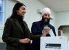 NDP leader Jagmeet Singh, right, and his wife Gurkiran Kaur, left, cast their ballets at an advanced polling station in his Burnaby South riding during a campaign stop in Burnaby, B.C., on Sunday, October 13, 2019. THE CANADIAN PRESS/Nathan Denette