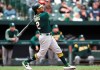 FILE - In this April 11, 2019, file photo, Oakland Athletics' Khris Davis watches his two-run home run against the Baltimore Orioles during the fourth inning of a baseball game in Baltimore. The Athletics are hoping to get injured slugger Davis back in the lineup for the middle game of a series against the first-place Houston Astros. Davis took batting practice before the series opener and could be activated from the injured list as early as Saturday, June 1. (AP Photo/Gail Burton, File)