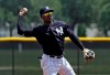 FILE - In this May 20, 2019, file photo, New York Yankees' Didi Gregorius throws the ball to first base in time to get a runner during a Gulf Coast League baseball game, in Tampa, Fla. Gregorius is back at shortstop for the New York Yankees, who are winning despite a slew of major injuries. Gregorius had Tommy John surgery in October, shortly after he injured his right elbow in the playoffs against Boston. (AP Photo/Chris O'Meara, File)