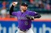 FILE - In this Sunday, May 6, 2018 file photo, Colorado Rockies relief pitcher Adam Ottavino delivers a pitch during the ninth inning of a baseball game against the New York Mets in New York. The New York Yankees finalized its $27 million, three-year contract with reliever Adam Ottavino on Thursday, Jan. 24, 2019 and said the 33-year-old right-hander will become the first player in the history of the tradition-bound team to wear No. 0. (AP Photo/Adam Hunger, File)
