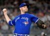 FILE - In this Sept. 14, 2018, file photo, Toronto Blue Jays pitcher Marco Estrada delivers to a New York Yankees batter during the first inning of a baseball game at Yankee Stadium in New York. Estrada agreed to a $4 million, one-year contract Friday, Jan. 25, with the Oakland Athletics, giving the club a veteran presence in a rotation that was plagued by injuries last season. (AP Photo/Bill Kostroun, File)