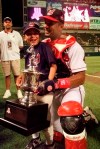 FILE - In this July 8, 1997, file photo, Cleveland Indians' Sandy Alomar shows off his MVP trophy with his son, Marcus, after the All-Star baseball game in Cleveland. With the game tied 1-1 in the seventh inning, Alomar, who had overcome serious knee issues that had threatened to derail his career, connected for a two-run homer that sent the crowd of 44,916 in perpetually sold-out Jacobs Field into delirium and pushed the AL to a 3-1 win. And while the home run was special for Alomar, his most vivid memory of that July night came after the game. (AP Photo/Beth A. Keiser, File)