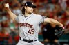 FILE - In this Oct. 27, 2019, file photo, Houston Astros starting pitcher Gerrit Cole throws against the Washington Nationals during the first inning of Game 5 of the baseball World Series in Washington. The top picks from the 2011 and 2009 drafts are both available this offseason. Cole gets the nod over Stephen Strasburg because he is two years younger. (AP Photo/Patrick Semansky, File)