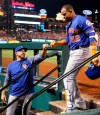 FILE - In this April 24, 2018, file photo, New York Mets' Yoenis Cespedes (52) is congratulated by manager Mickey Callaway after hitting a three-run home run during the fifth inning of a baseball game against the St. Louis Cardinals in St. Louis. The slumping Mets have announced they are sticking with embattled manager Callaway 
